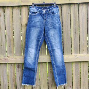Straight Leg (not skinny) jeans with ragged legs.  Size 8